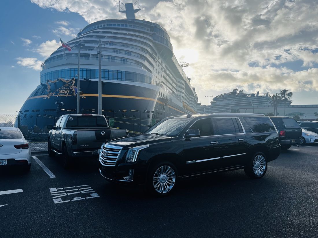 Fleet of black luxury SUVs lined up